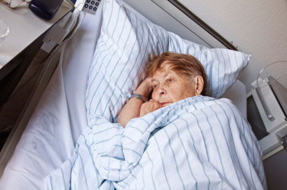 Elderly patient in hospital bed