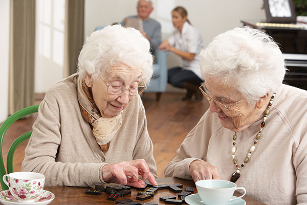 Two-Senior-Women-Playing-Dominoes-shutterstock