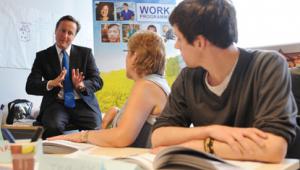 David Cameron visits one of the government’s Work Programme schemes as he backs an extension of payment by result contracts in the public sector.