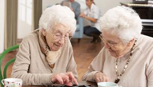 Two-Senior-Women-Playing-Dominoes-shutterstock