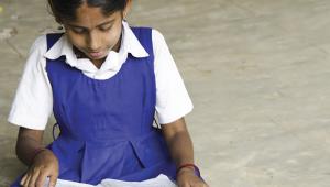 Indian schoolgirl reading