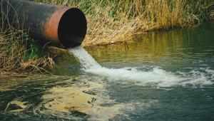 Draining sewage pipe into a river