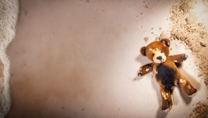 Burnt teddy bear washed up on a beach - Credit: Firefly Adobe - 17781