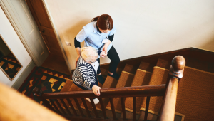Care worker with client - Credit: Istock - 941789612