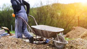 Worker with wheelbarrow 