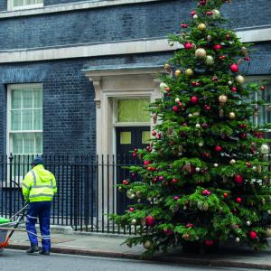 Rubbish collector outside number 10 