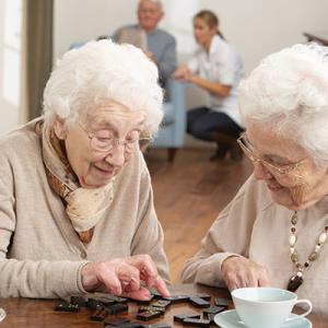 Two-Senior-Women-Playing-Dominoes-shutterstock