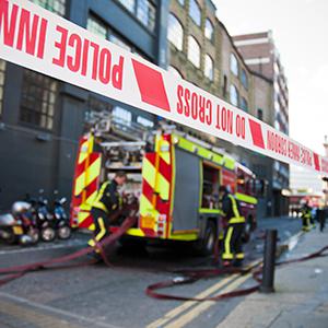 Home Secretary Theresa May has said further integration of the operations of the three emergency services will be needed in the next parliament in response to budget cuts.