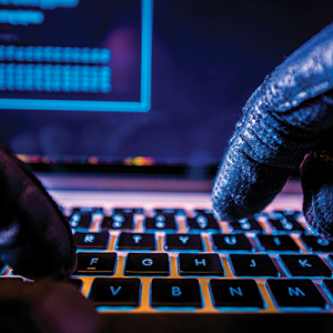 Fraud Hacker on Laptop iStock