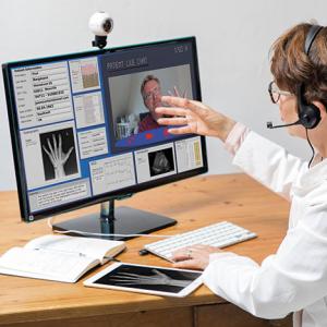 Doctor Communicating with Patient Via Video Calling Alamy