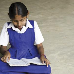 Indian schoolgirl reading