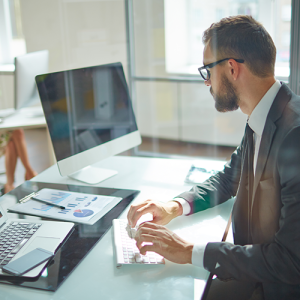 Man working at computer Shutterstock 309941807