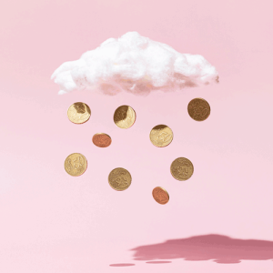 Money rain concept made of gold coins and white cloud on pink background.credit-istock-1342894966