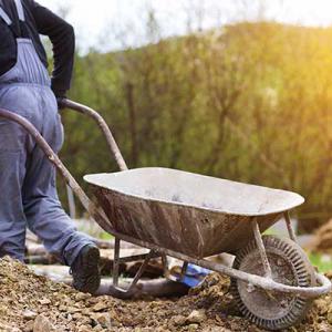 Worker with wheelbarrow 